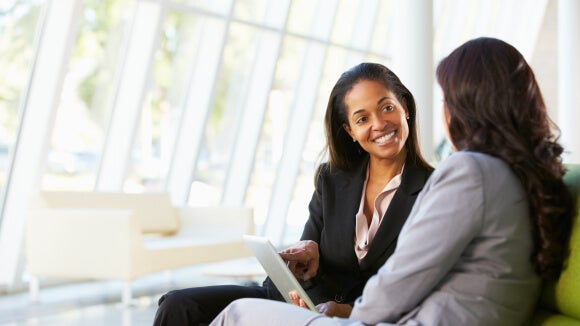 woman motivating her employee woman motivating her employee