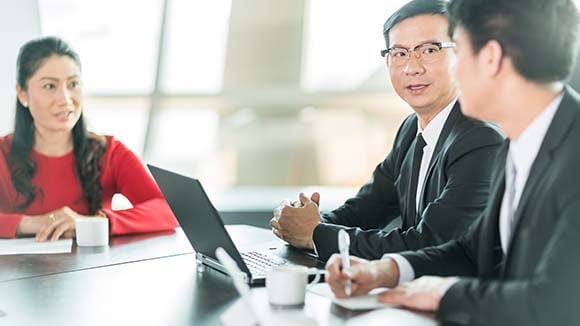 three-people-in-business-meeting