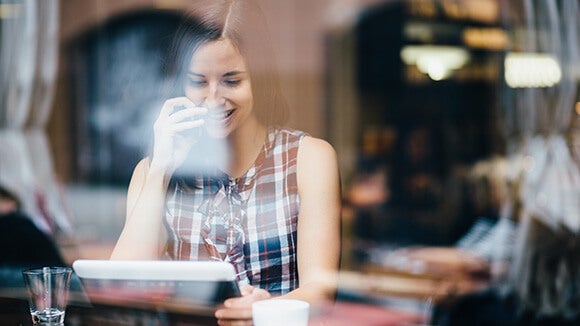 white female on tablet white female smiling on tablet