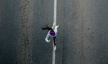 Woman running aerial view