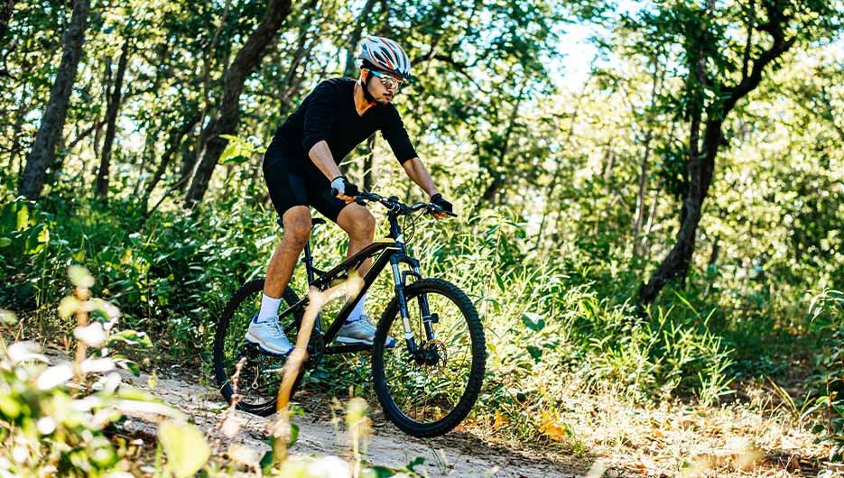 man on bike in jungle